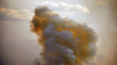 Wildfire smoke rises into the sky