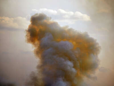 Wildfire smoke rises into the sky