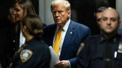 Former President Donald Trump leaves the courtroom at the end of the day's proceedings in his criminal trial for allegedly covering up hush money payments at Manhattan Criminal Court on May 14, 2024, in New York City.