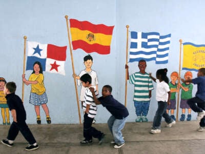 Schoolchildren walk back to class and play in front of a mural on December 12, 2005, in Pasadena, California.