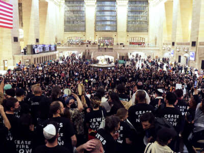 Hundreds of people wearing shirts reading "JEWS SAY CEASEFIRE NOW" fill Grand Central Station