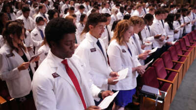 Medical students recite an oath they wrote together during the University of Minnesota Medical Schools annual White Coat Ceremony for the class of 2026 on August 19, 2022, in Minneapolis, Minnesota.
