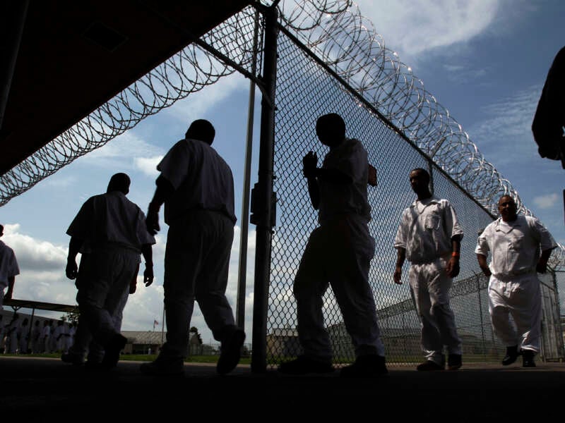 Incarcerated people in Texas walk outside