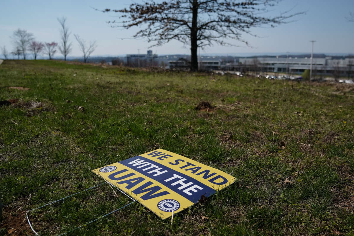 A United Auto Workers (UAW) lawn sign sits on the ground near a Volkswagen automobile assembly plant on March 20, 2024, in Chattanooga, Tennessee.