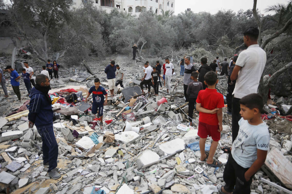 Palestinians inspect the destroyed buildings in Ez-Zawayda area after the Israeli attack in the central part of Gaza targeted the town of Ez-Zawayda and the Nuseirat Refugee Camp, resulting in numerous casualties in Deir al-Balah, Gaza, on May 11, 2024. It is reported that 20 people, including children and babies, were killed and many others injured in the Israeli attacks on Maghazi Camp and Az Zawayda areas in the central Gaza Strip.