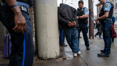 Police arrest a man as the city of Philadelphia begins a long anticipated clearing of the homeless encampment in Kensington on May 8, 2024, in Philadelphia, Pennsylvania.