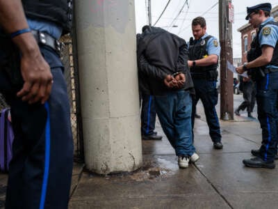 Police arrest a man as the city of Philadelphia begins a long anticipated clearing of the homeless encampment in Kensington on May 8, 2024, in Philadelphia, Pennsylvania.