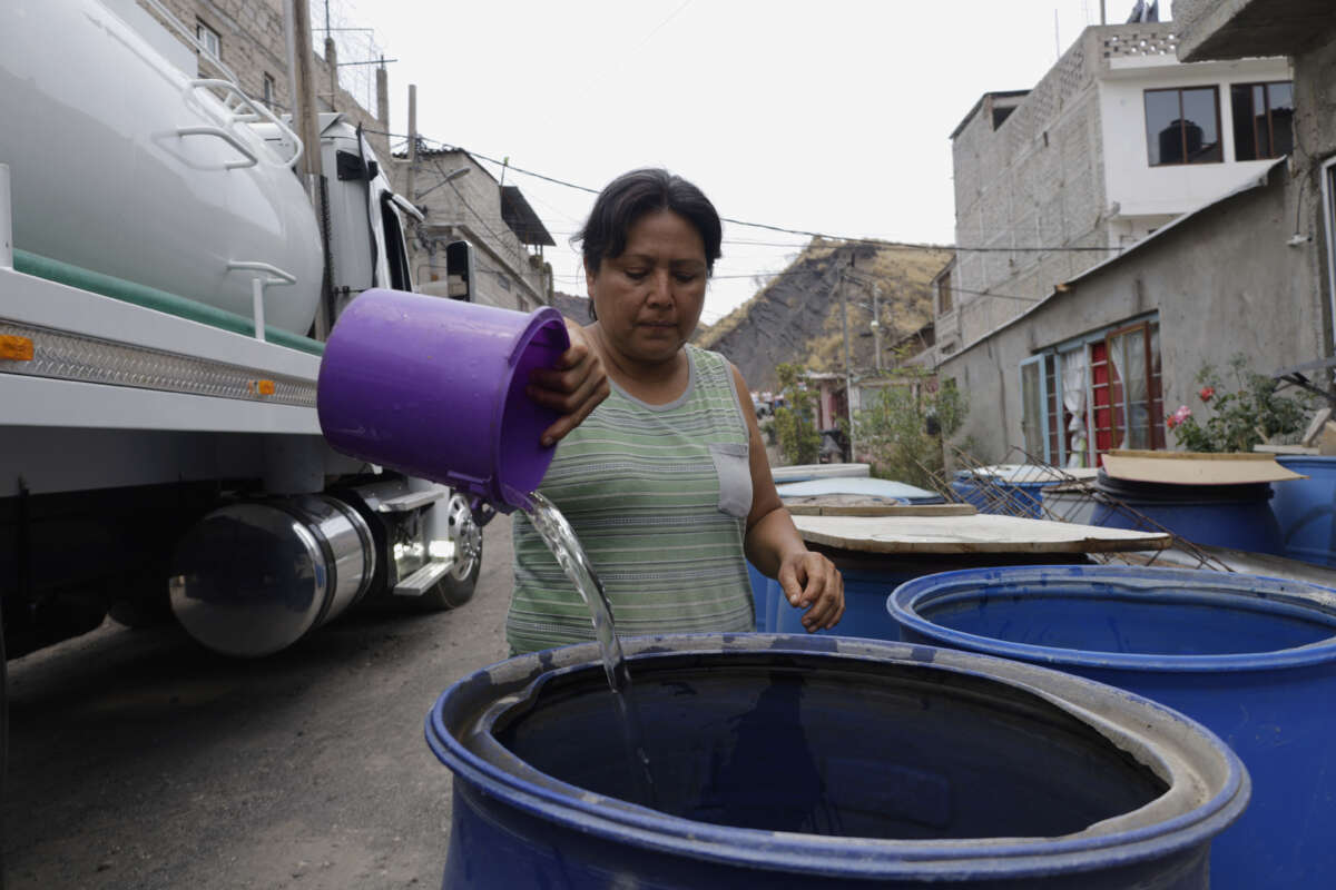 People are using bins to store water for their homes inside the property known as El Yuguelito, an irregular piece of land located in the Polvorilla Colony in the Iztapalapa mayor's office in Mexico City, Mexico.