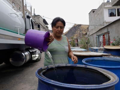 People are using bins to store water for their homes inside the property known as El Yuguelito, an irregular piece of land located in the Polvorilla Colony in the Iztapalapa mayor's office in Mexico City, Mexico.