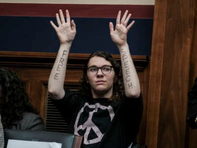 A demonstrator attends a hearing called "Calling for Accountability: Stopping Antisemitic College Chaos" before the House Committee on Education and the Workforce on May 23, 2024 in Washington, D.C. 