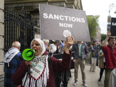 Protesters take part in an Ireland Palestine Solidarity campaign demonstration outside Leinster House, Dublin, calling for sanctions on Israel, on May 29, 2024.
