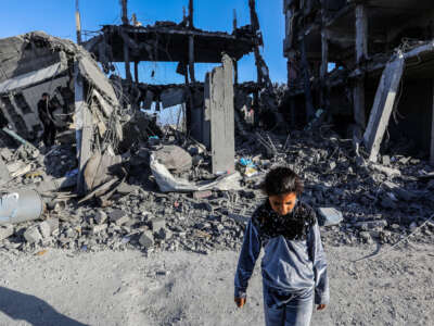 Palestinians examine destroyed and damaged buildings in the east of Rafah, Gaza, on April 20, 2024.