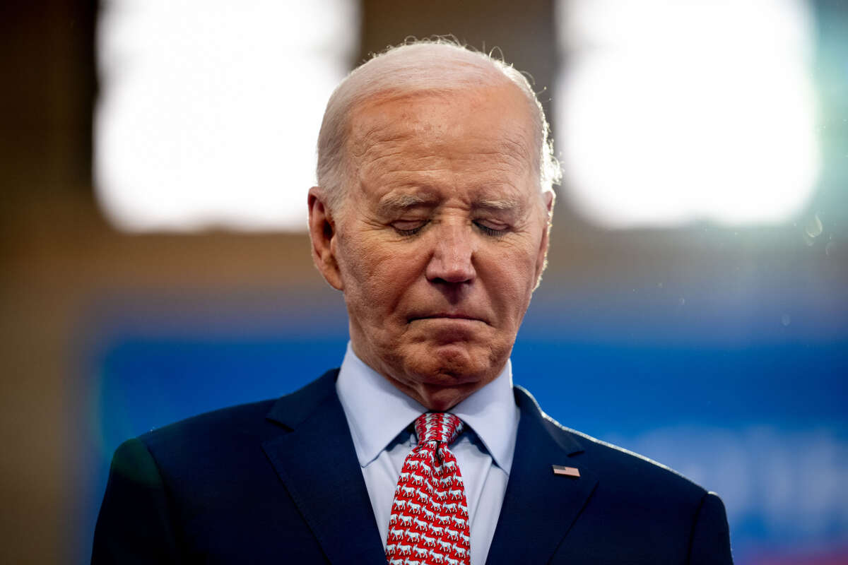 President Joe Biden stands on stage as Vice President Kamala Harris introduces him during a campaign rally at Girard College on May 29, 2024, in Philadelphia, Pennsylvania.