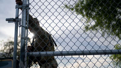 A National Guard soldier patrols at the entrance of Shelby Park on March 12, 2024, in Eagle Pass, Texas.