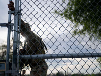 A National Guard soldier patrols at the entrance of Shelby Park on March 12, 2024, in Eagle Pass, Texas.