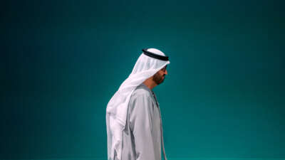 Sultan Ahmed Al Jaber walks to the right