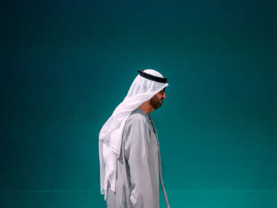 Sultan Ahmed Al Jaber walks to the right