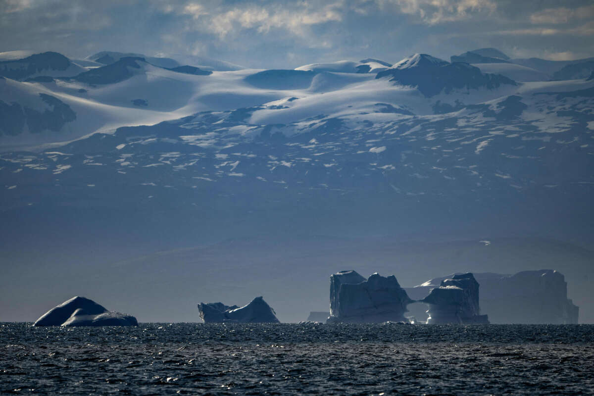 Melting icebergs drift off near a glacier in Scoresby Sound, Greenland, on August 16, 2023.