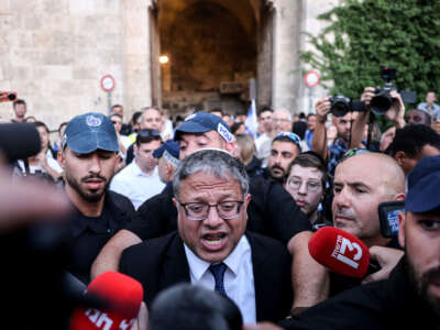 Israel's National Security Minister Itamar Ben-Gvir speaks to the press as he joins Jewish nationalists, including far-right activists, rallying at Jerusalem's Damascus Gate on June 5, 2024, during the so-called Jerusalem Day flag march.