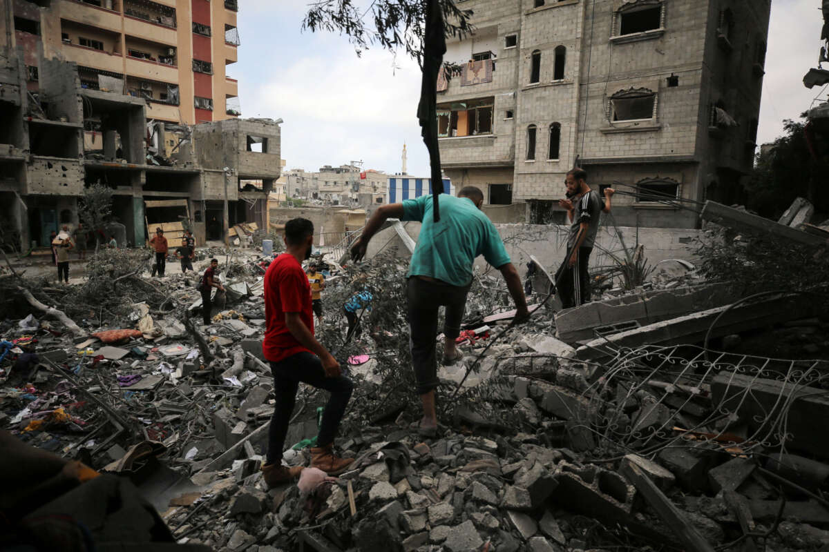 Palestinians inspect debris a day after a massacre carried out by the Israeli military in the Nuseirat refugee camp, in the central Gaza Strip, on June 9, 2024.