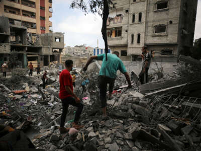 Palestinians inspect debris a day after a massacre carried out by the Israeli military in the Nuseirat refugee camp, in the central Gaza Strip, on June 9, 2024.