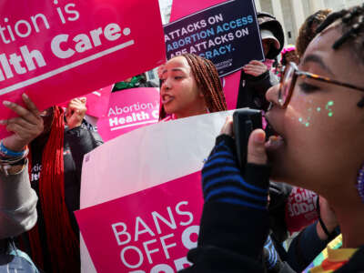 Demonstrators holds signs and shout slogans in front of the Supreme Court which is hearing arguments related to FDA v. Alliance for Hippocratic Medicine Tuesday, March 26, 2024, in Washington, D.C.