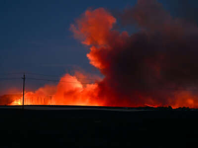 A view of transmission towers in flames as the Corral Fire burns in San Joaquin County, California, on June 2, 2024.