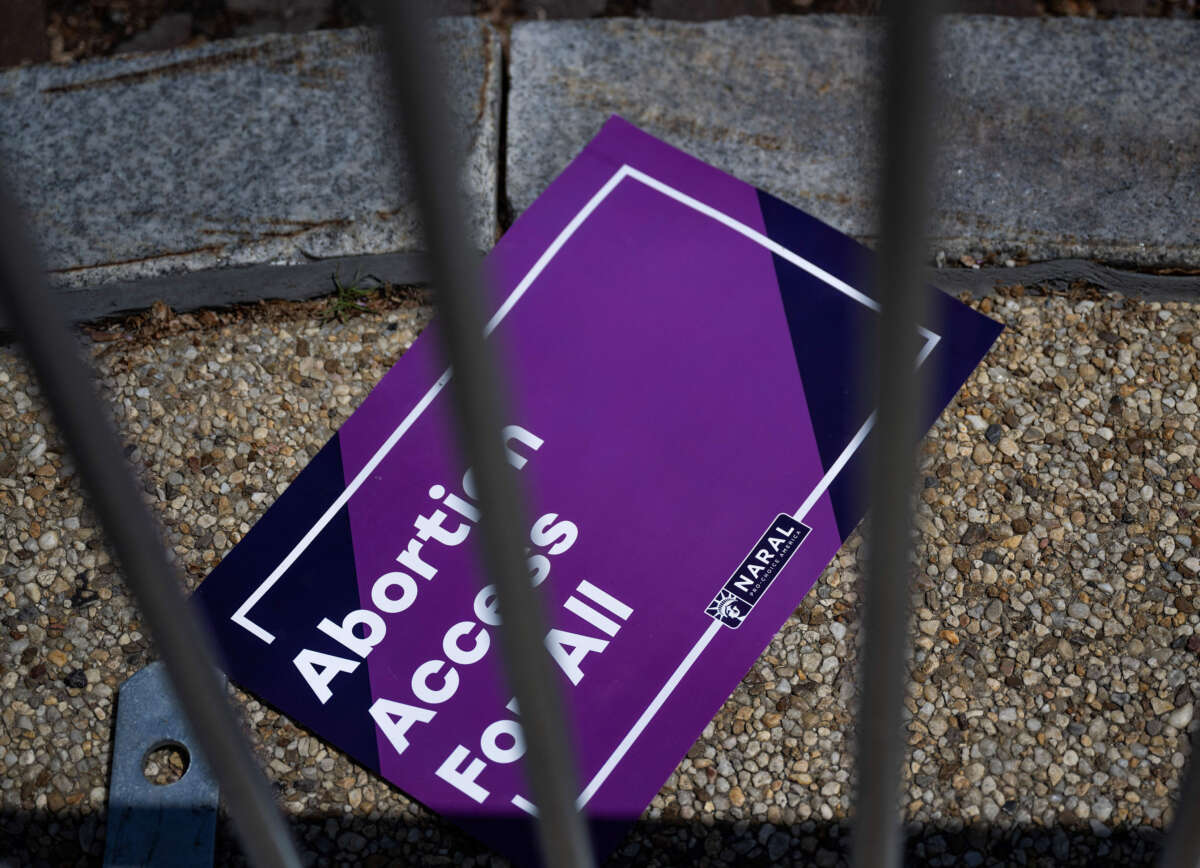 A sign reading Abortion Access For All is seen on the floor during a rally in support of abortion rights at the U.S. Supreme Court in Washington, D.C., on April 15, 2023.