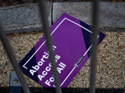 A sign reading Abortion Access For All is seen on the floor during a rally in support of abortion rights at the U.S. Supreme Court in Washington, D.C., on April 15, 2023.