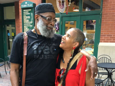 Sekou Odinga and dequi kioni-sadiki stand in front of a favorite ice cream parlor while on a trip to Memphis, Tennessee, on August 21, 2017.