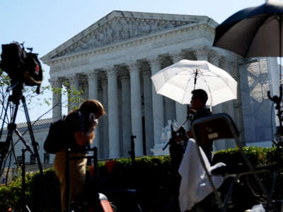 TV journalists work outside of the U.S. Supreme Court Building on June 14, 2024, in Washington, D.C.