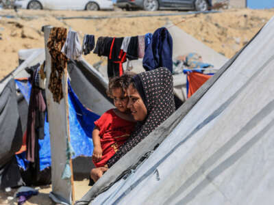 Palestinians, who fled their homes due to the Israeli attacks on Gaza, try to go on their daily lives under hard conditions in Deir Al Balah, Gaza, on June 19, 2024.