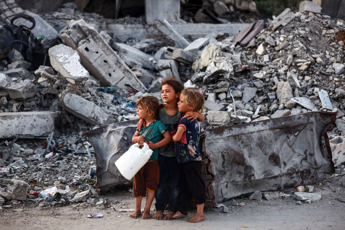 Palestinian girls attend Eid al-Adha prayers in Bureij Refugee Camp in the central Gaza Strip, on June 16, 2024.