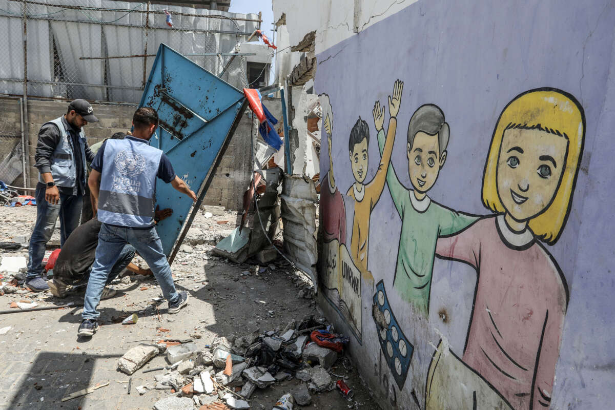 Workers of UNRWA (United Nations Relief and Works Agency for Palestinian Refugees) inspect destruction after an attack carried out by Israeli army on a building belonging to the UNRWA located in the Nuseirat Refugee Camp in Deir al-Balah, Gaza, on May 26, 2024.