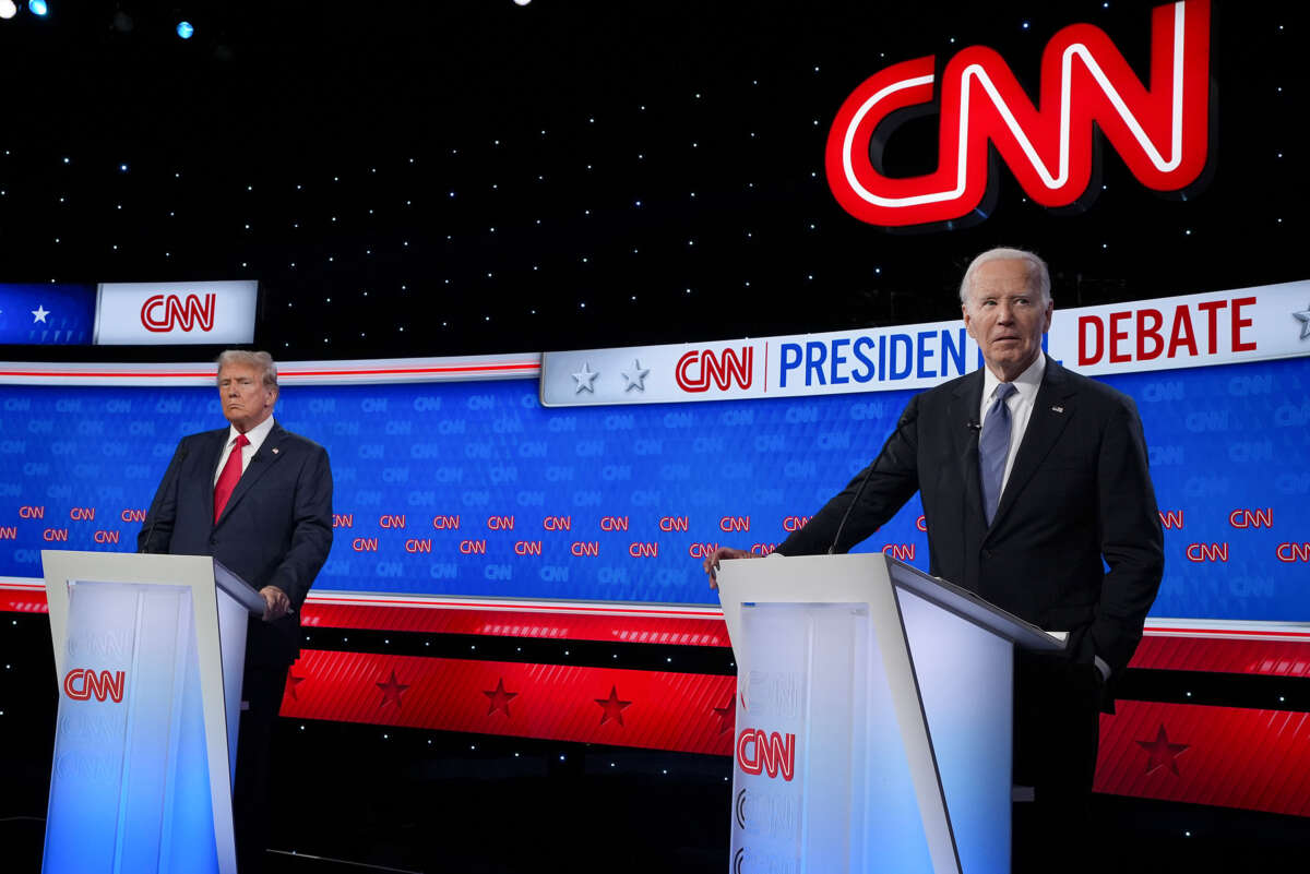 President Joe Biden (right) and former President Donald Trump participate in the CNN Presidential Debate at the CNN Studios on June 27, 2024, in Atlanta, Georgia.