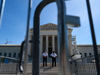 Supreme Court Police officers stand on the steps outside of the Supreme Court on April 16, 2024, in Washington, D.C.