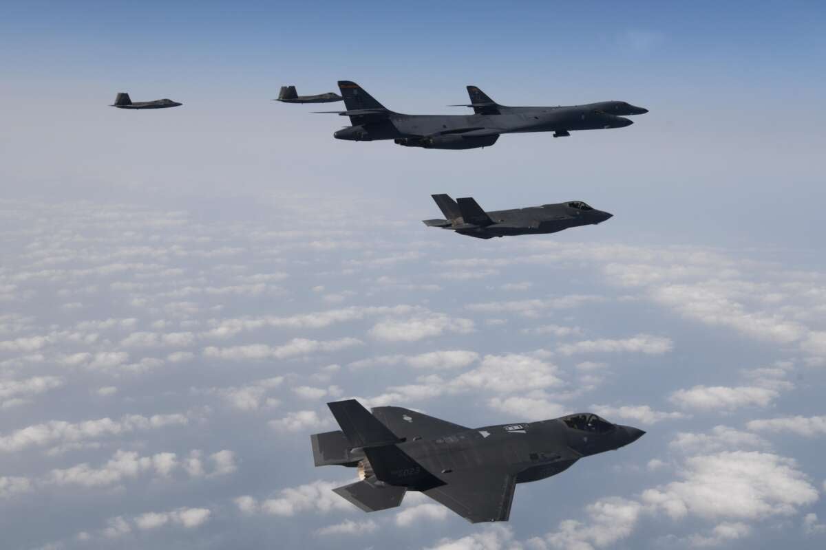 In this handout image released by the South Korean Defense Ministry, U.S. Air Force B-1B bombers (right), F-22 fighter jets and South Korean Air Force F-35 fighter jets (bottom) fly over South Korea Peninsula during a joint air drill on February 1, 2023 at an undisclosed location in South Korea.