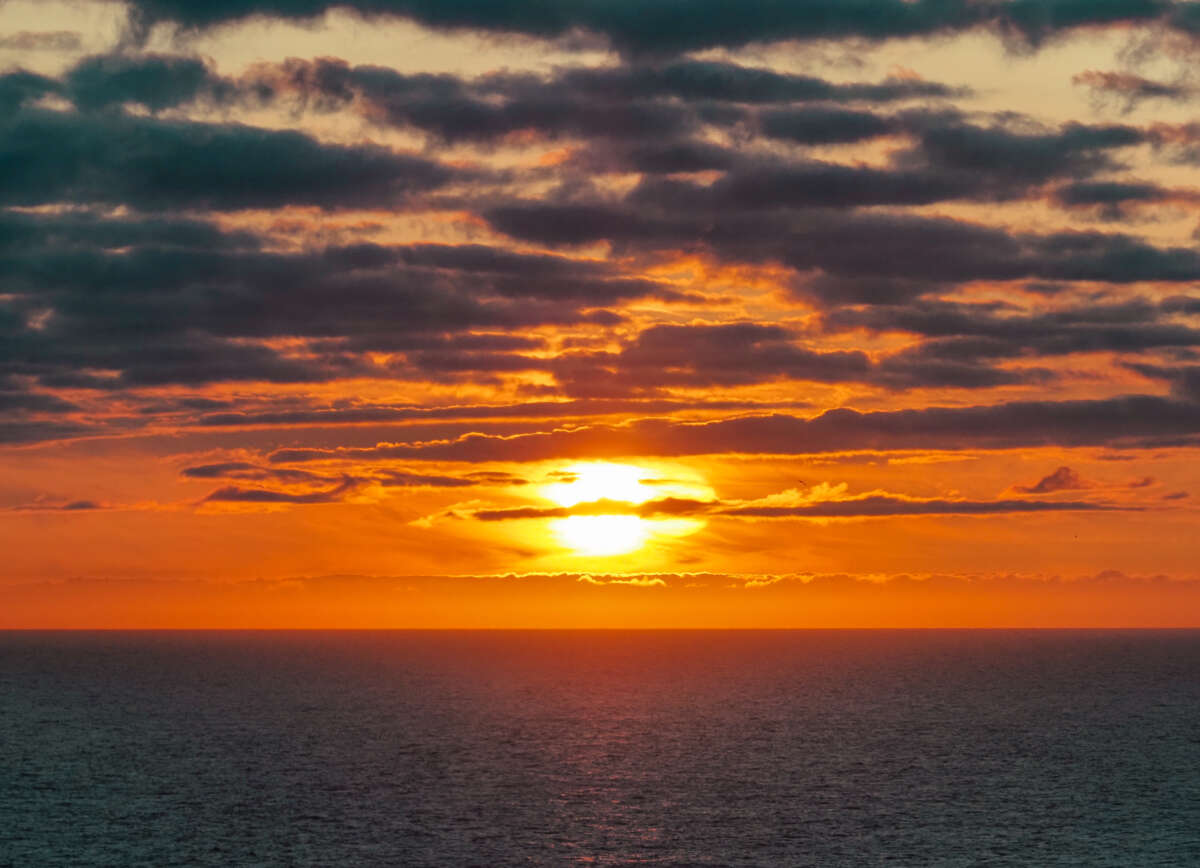 The sun sets over the Arctic Ocean near the North Cape on August 23, 2023, in Honningsvag, Norway.