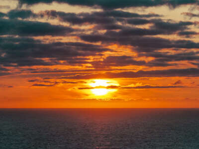 The sun sets over the Arctic Ocean near the North Cape on August 23, 2023, in Honningsvag, Norway.