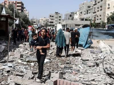 Palestinians try to move to safer areas following the Israeli attacks on Nuseirat refugee camp in Gaza City, Gaza, on June 8, 2024. It was reported that 210 people were killed and at least 400 people were wounded in the simultaneous attacks.