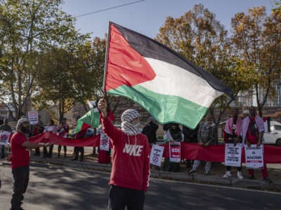 Dozens of people gather in front of the U.S. embassy to organize a demonstration in support of Palestinians in Johannesburg, South Africa, on June 15, 2024.
