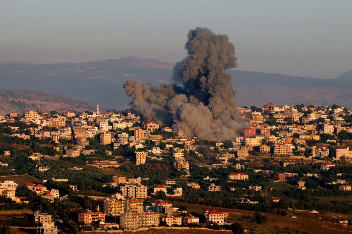 Black smoke billows following an Israeli air strike that targeted a house in the southern Lebanese village of Khiam near the Lebanese-Israeli border on June 21, 2024.