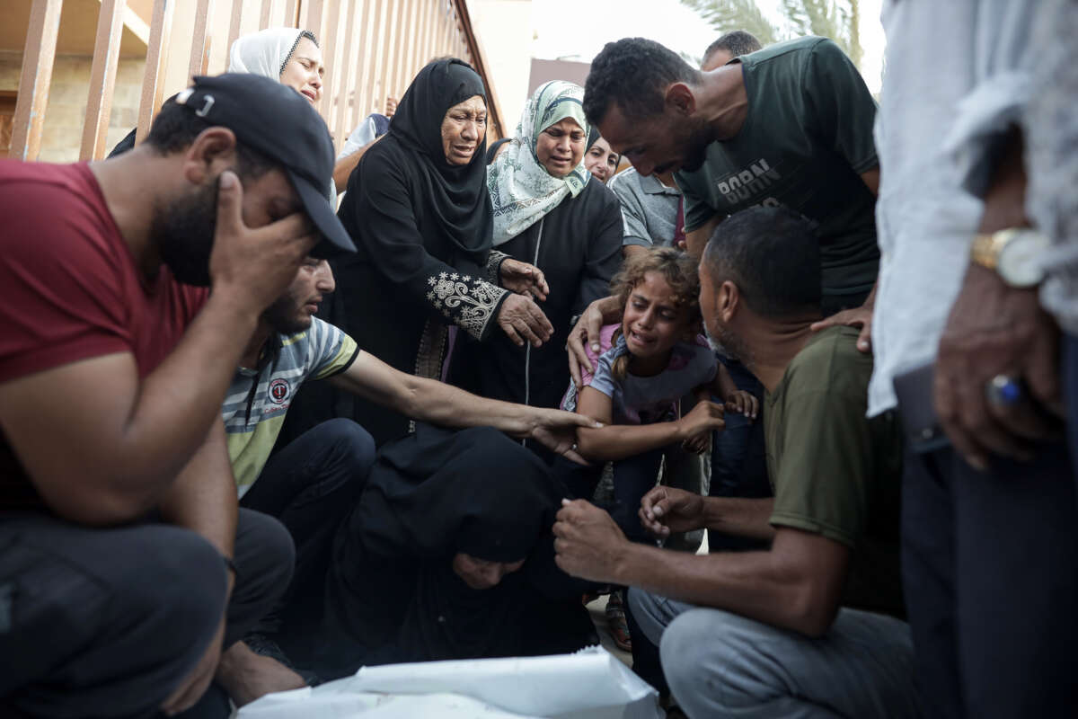 Displaced Palestinians mourn during a funeral ceremony for their relatives after Israeli airstrikes killed 25 and injured 50 people at Al-Nasr Hospital in al-Mawasi neighborhood of Rafah, Gaza, on June 21, 2024.