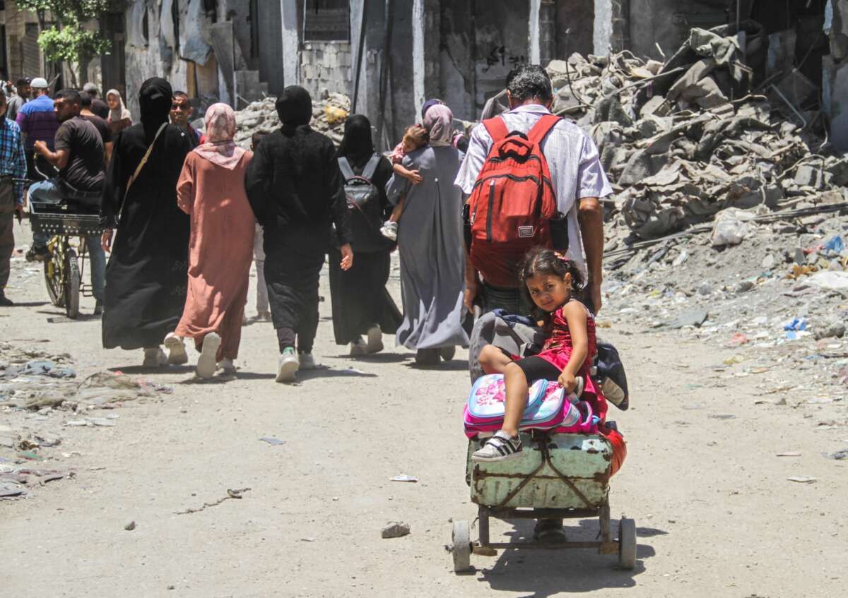 People flee their homes in the neighborhood of Shuja'iya in the east of Gaza City, on June 27, 2024.