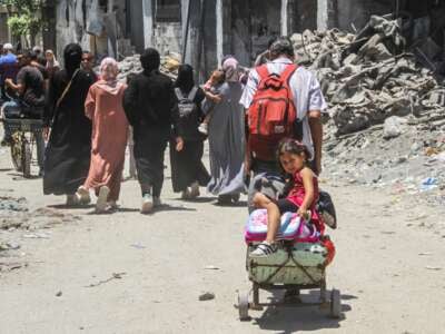 People flee their homes in the neighborhood of Shuja'iya in the east of Gaza City, on June 27, 2024.
