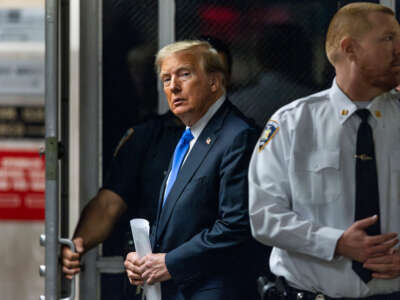 Former President Donald Trump arrives to the courthouse as the jury is scheduled to continue deliberations for his hush money trial at Manhattan Criminal Court on May 30, 2024, in New York City.