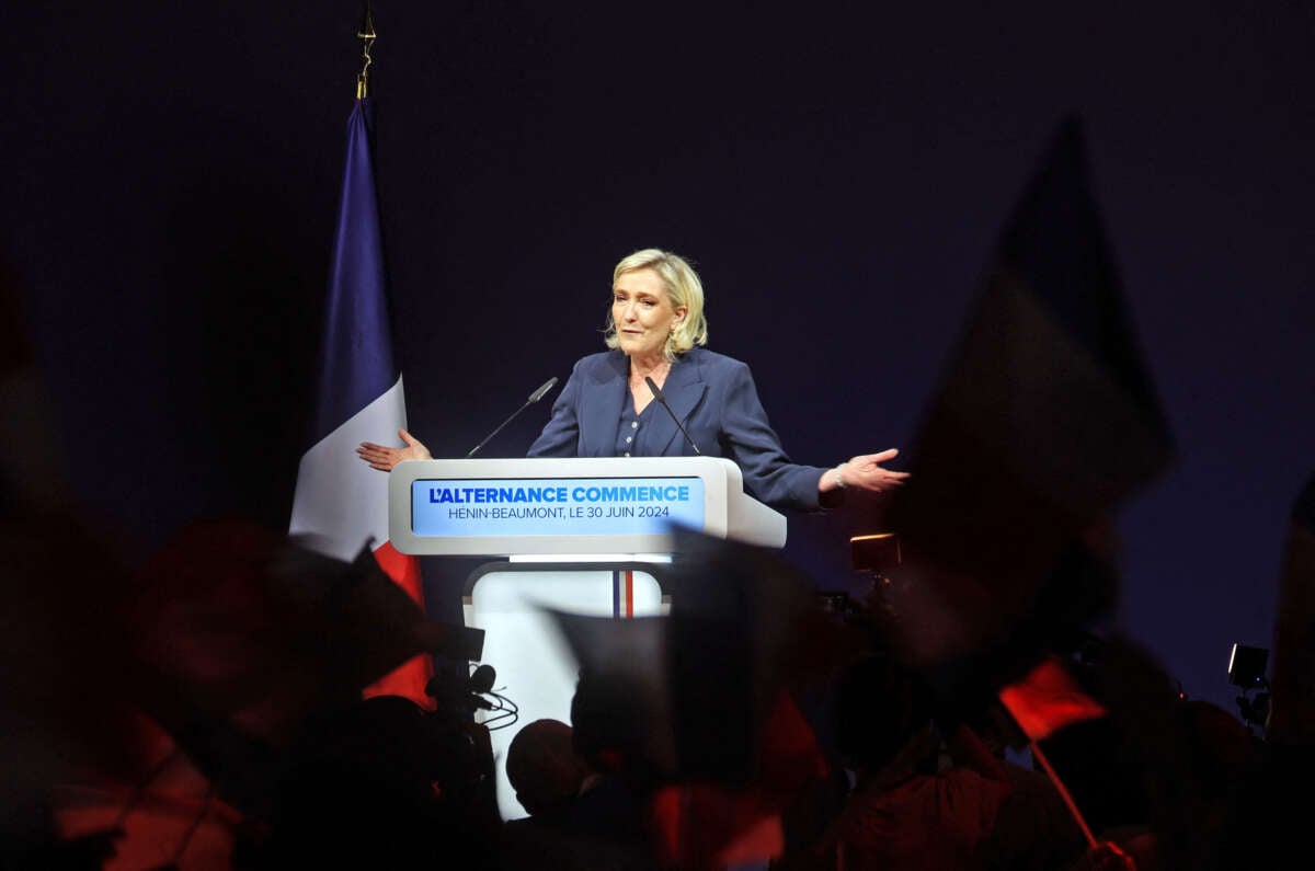 Marie Le Pen speaks at a podium