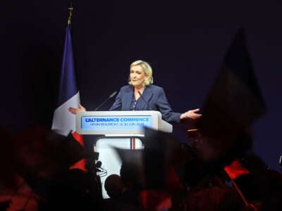 Marie Le Pen speaks at a podium