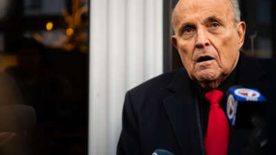Rudy Giuliani speaks to members of the media where Republican candidate Florida Gov. Ron DeSantis was scheduled to host a campaign event on January 21, 2024, in Manchester, New Hampshire.