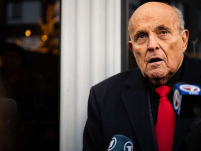 Rudy Giuliani speaks to members of the media where Republican candidate Florida Gov. Ron DeSantis was scheduled to host a campaign event on January 21, 2024, in Manchester, New Hampshire.
